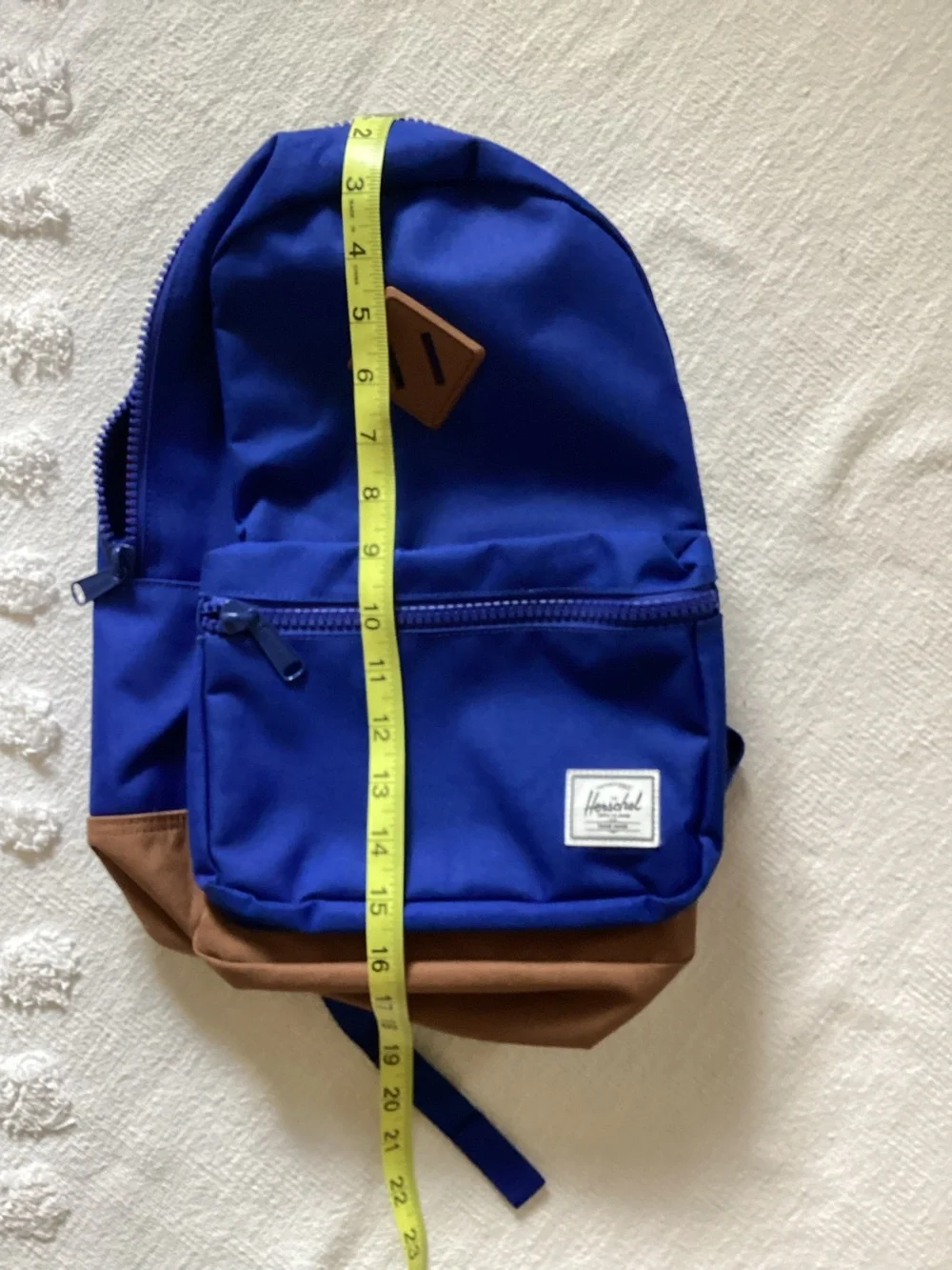 Herschel Supply Co. Heritage youth backpack in a blue and brown colorway.